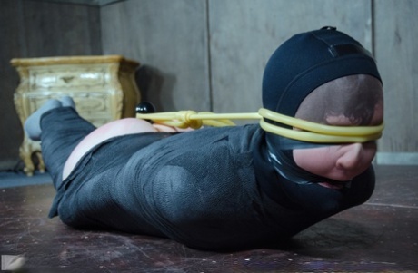 Caucasian girl Bonnie Day finds herself restrained in a dungeon after a stroll