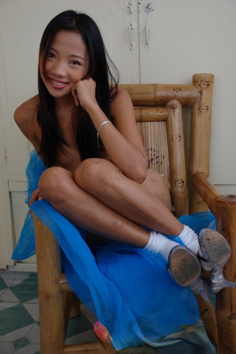 Skinny Filipina girl models naked while wearing white socks