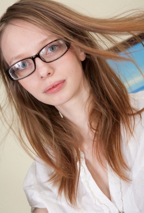 Nerdy secretary takes off upskirt panties before stripping naked at work