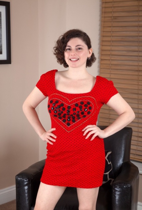 First timer Romy parts her natural twat after removing a red dress and panties