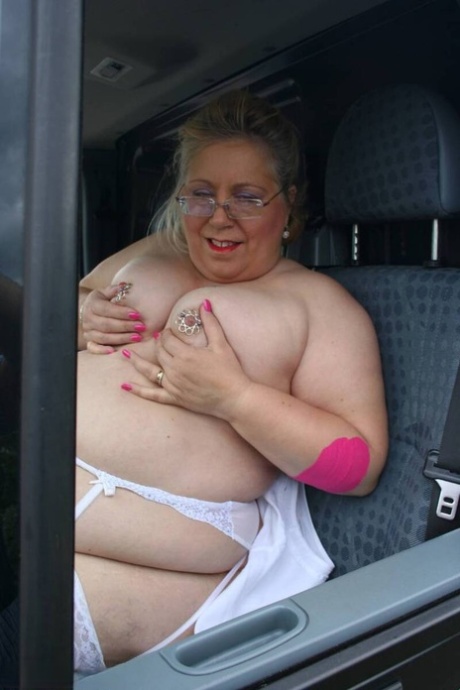 Fat older UK lady Lexie Cummings sports a butt plug while showing her snatch