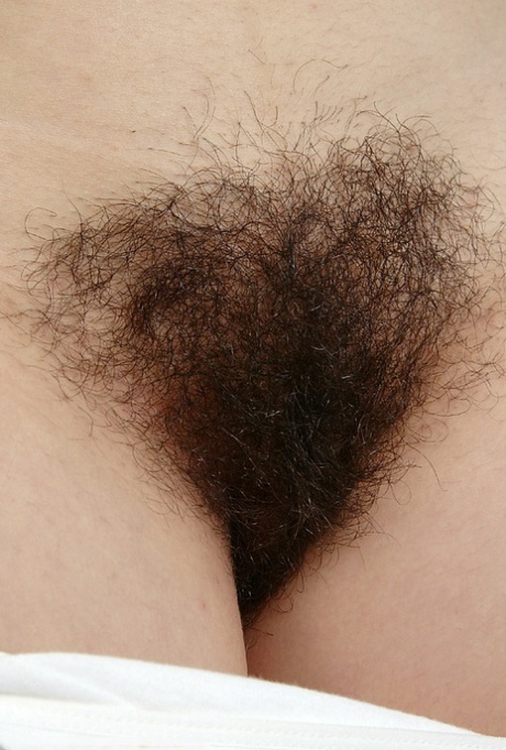 Amateur woman Lin pulls down her white panties to expose hairy bush