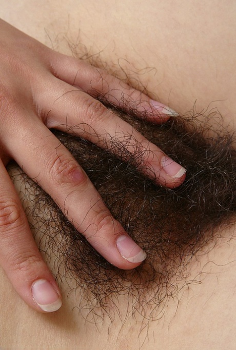 Amateur woman Lin pulls down her white panties to expose hairy bush