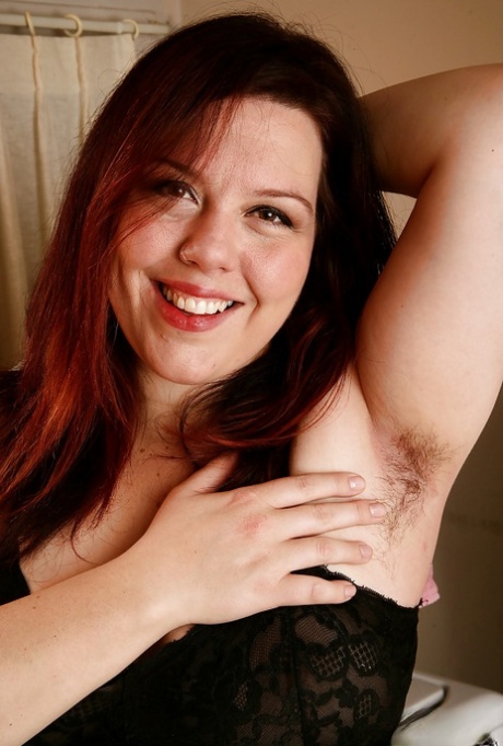 Pantyhose adorned plumper showing off hairy armpits and beaver