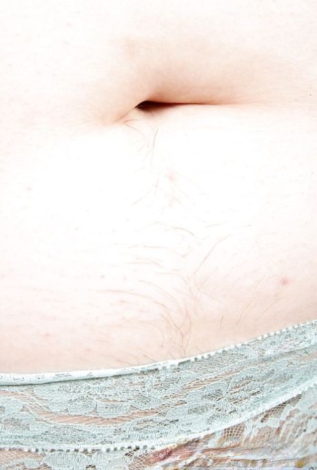 Mature overweight woman slides panties to one side to reveal hairy snatch