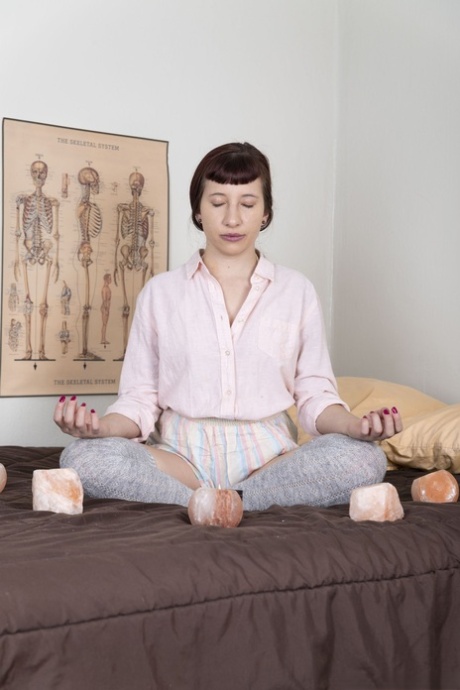 Meditation teacher Calliope loses her clothes and fingers her fuzzy twat