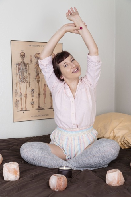Meditation teacher Calliope loses her clothes and fingers her fuzzy twat