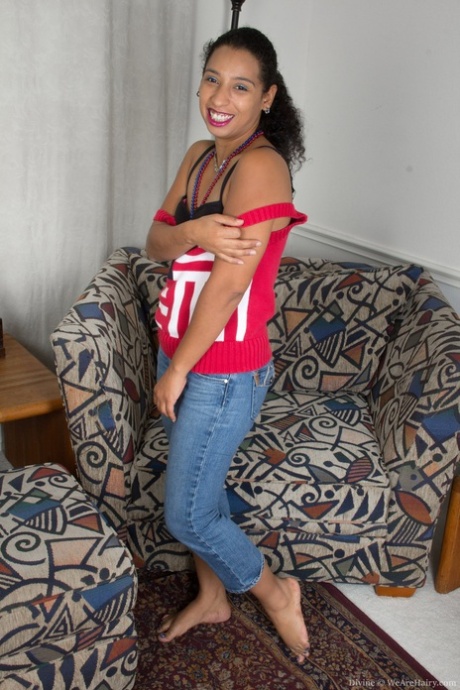 Exotic ebony with tiny tits Divine removes her clothes and shows bushy pussy