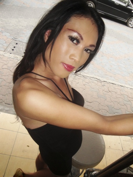 Lusty ladyboy Joy plays with her hairy small cock and toys her booty