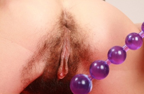 Brunette lady Vixen toys her beaver and asshole at the same time
