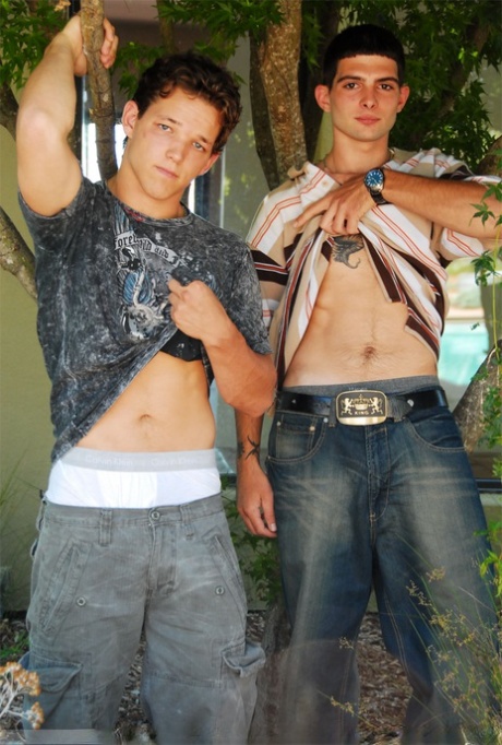 Inked stud Anthony Smith leans over and sucks his roommate Lee Stephens's rod