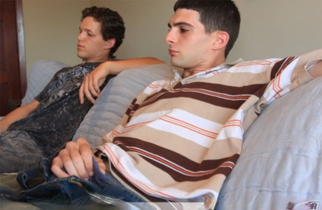 Inked stud Anthony Smith leans over and sucks his roommate Lee Stephens's rod