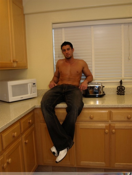 Sexy muscular stud Cody Cummings wanks his big rod on the kitchen counter