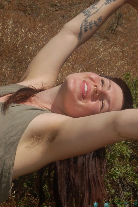 Tall chick Olivia Rose strips in nature and shows her hairy vagina up close