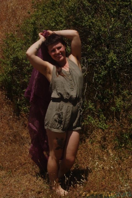 Tall chick Olivia Rose strips in nature and shows her hairy vagina up close