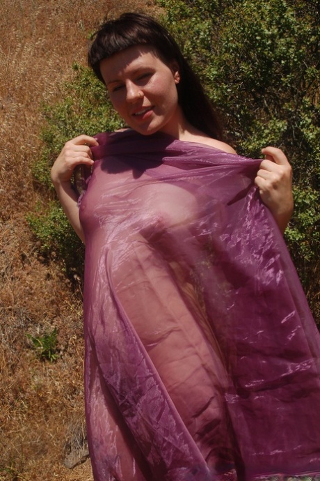 Tall chick Olivia Rose strips in nature and shows her hairy vagina up close