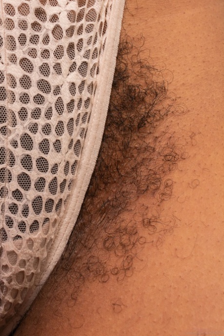 Curvaceous amateur Erykah Ohms displays her exotic hairy pussy up close