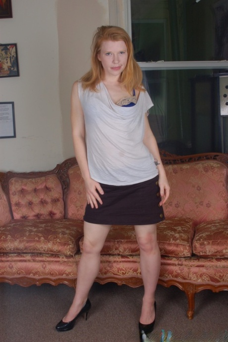 Hairy redhead Madison Young displays her protruding labia up close