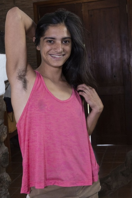 Exotic teen Karen H exposes her hairy armpits and twat and poses nude