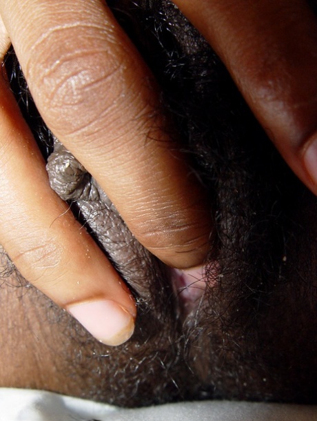 Exotic ebony beauty Satya shows her big tits & fingers her hairy twat