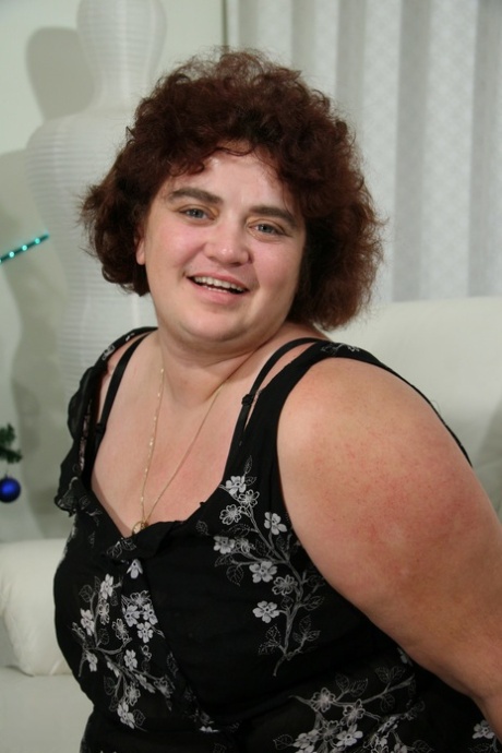 Curly haired fat woman Kitty reveals her big ass and toys her bushy holes